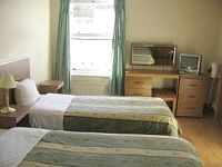 A twin room at Carlton Hotel London