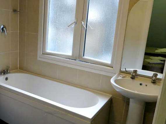 An ensuite bedroom at Corbigoe Hotel