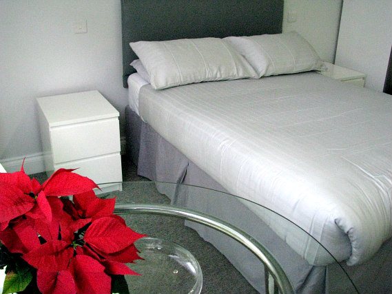 Rest easy in a comfortable bed in your room