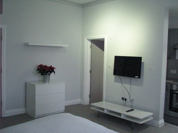 Put your feet up in front of the TV in your room