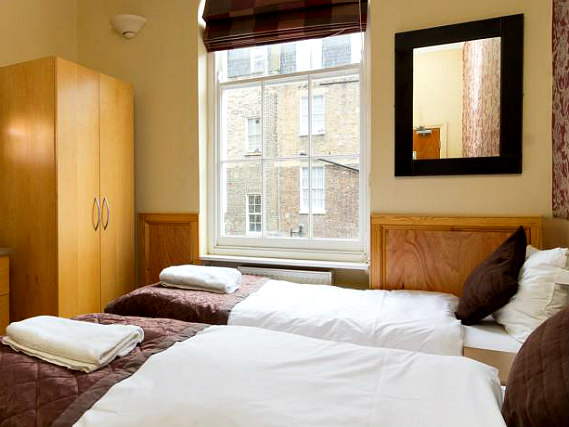 Une chambre avec lits jumeaux de Excelsior Hotel