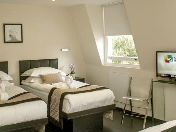 Une chambre avec lits jumeaux de 39 Suites London
