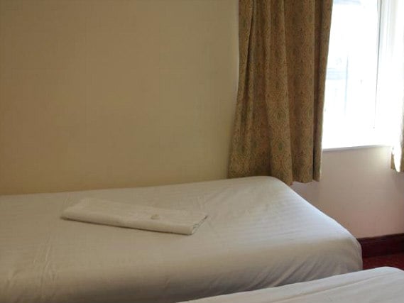 Une chambre avec lits jumeaux de Hotel Olympia