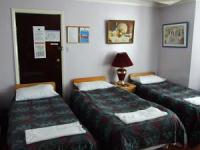 A typical triple room at Jims Guest House