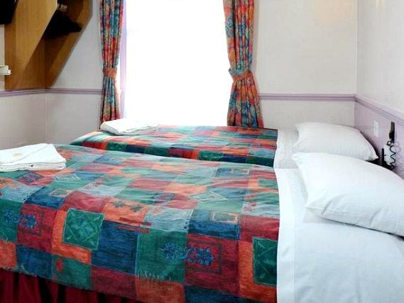 Une chambre avec lits jumeaux de Marble Arch Inn