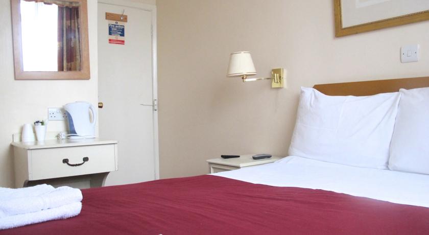 Une chambre à Chiswick Lodge Hotel