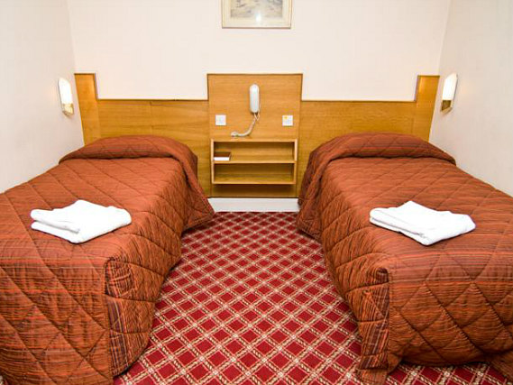 A twin room at Alexandra Hotel is perfect for two guests