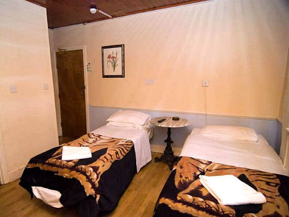 A twin room at Ventures Hotel is perfect for two guests