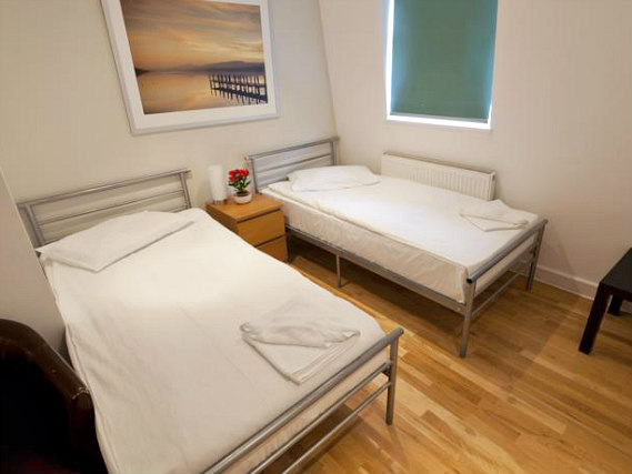 Une chambre avec lits jumeaux de 146 Suites Gloucester Place
