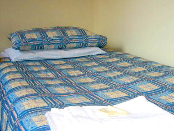 Rest easy in a comfortable bed in your room