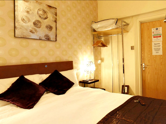 Put your feet up in front of the TV in your room at Hotel Onesixtwo