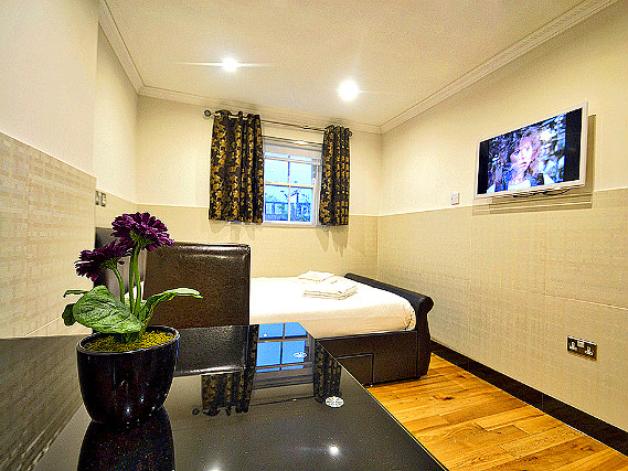 Put your feet up in front of the TV in your room