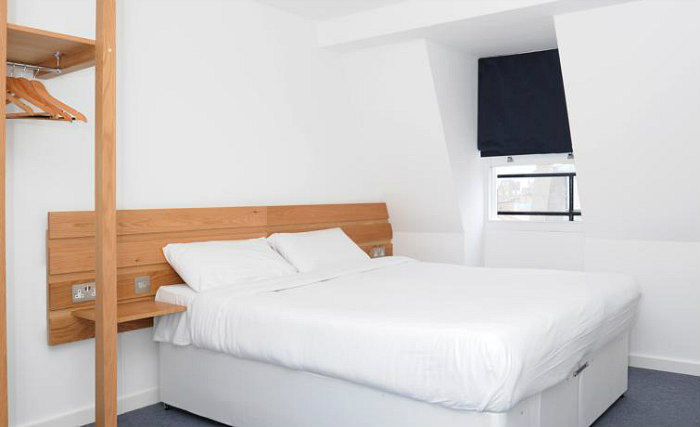 Put your feet up in front of the TV in your room