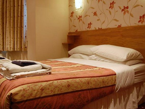 A double room including a desk