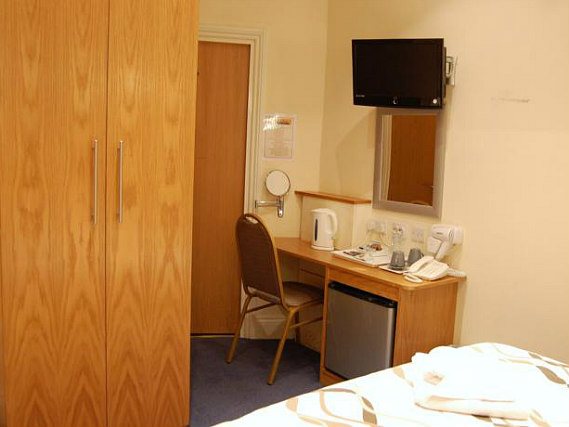 Put your feet up in front of the TV in your room