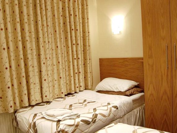 Relax after a long day of sightseeing in your garden twin room