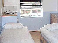 A typical Twin room at The Pay and Sleep