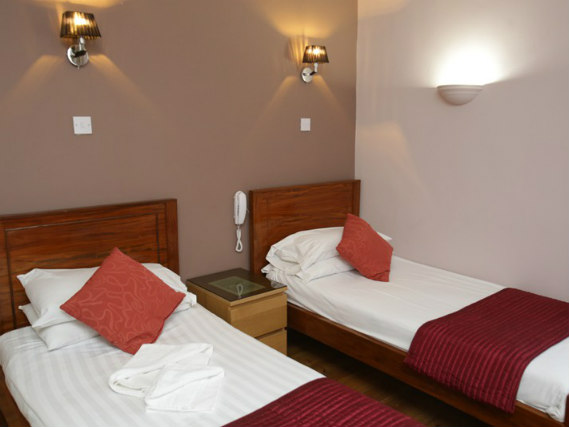 Une chambre avec lits jumeaux de Merchant City Inn