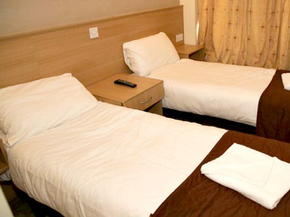 Une chambre avec lits jumeaux de Holland Court Hotel