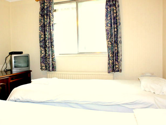 A spacious twin room at Heathrow Lodge