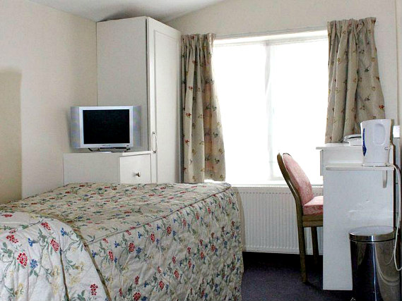 Put your feet up in front of the TV in your room