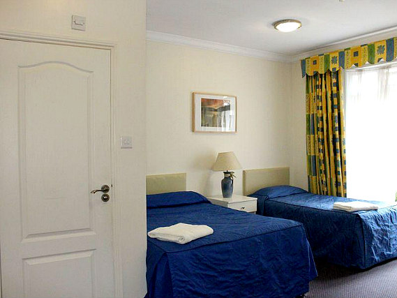 Rest easy in a comfortable bed in your room