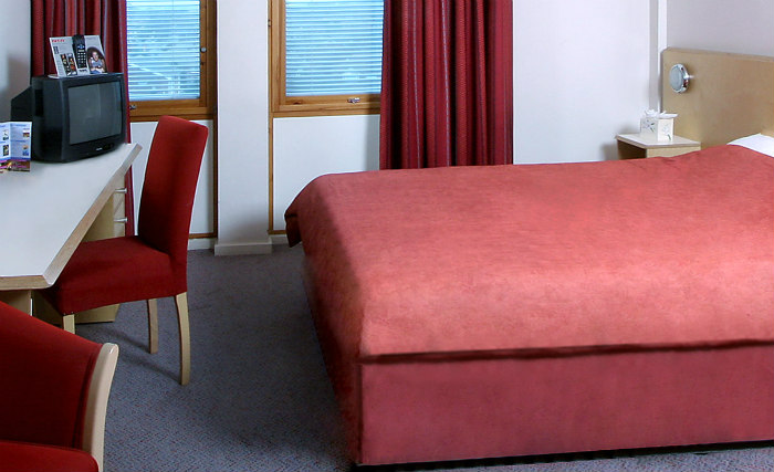 Rest easy in a comfortable bed in your room