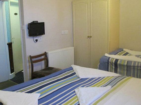 Une chambre avec lits jumeaux de Boston Manor Hotel