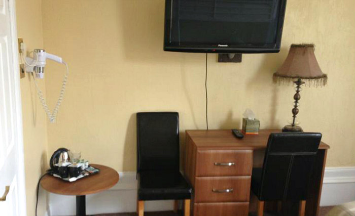 Put your feet up in front of the TV in your room