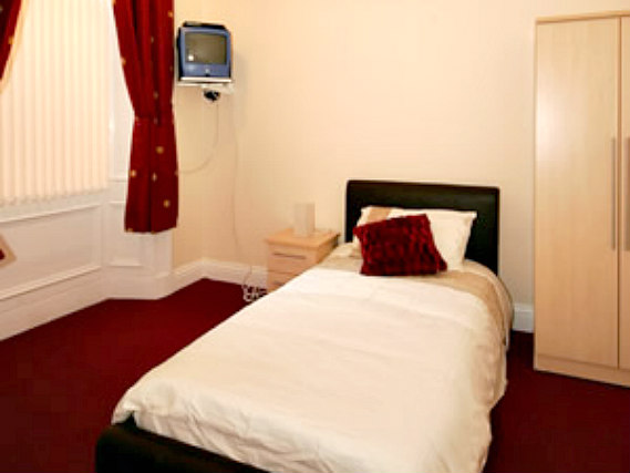 Rest easy in a comfortable bed in your room