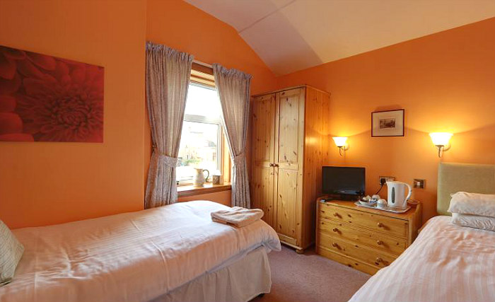 Rest easy in a comfortable bed in your room