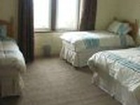 A quad room at the Dunard Guest House