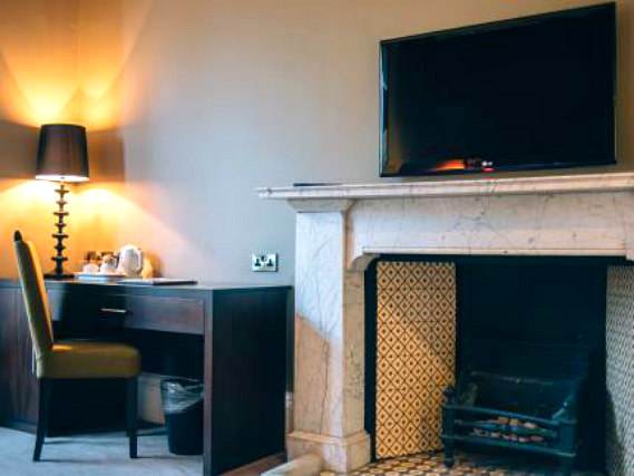Put your feet up in front of the TV in your room at Links Hotel