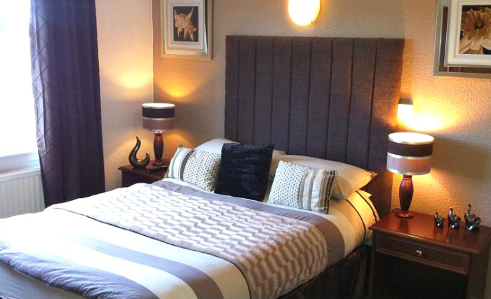 Rest easy in a comfortable bed in your room