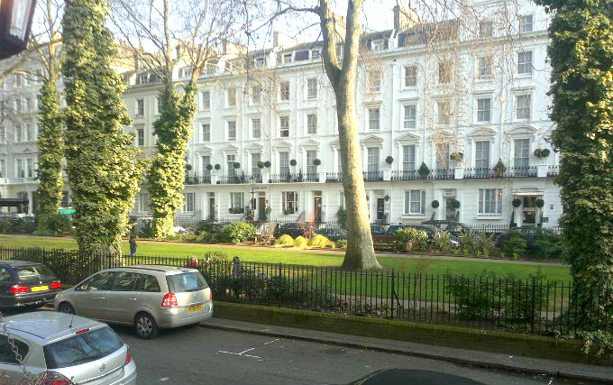 The attractive gardens and exterior of So Paddington Hotel