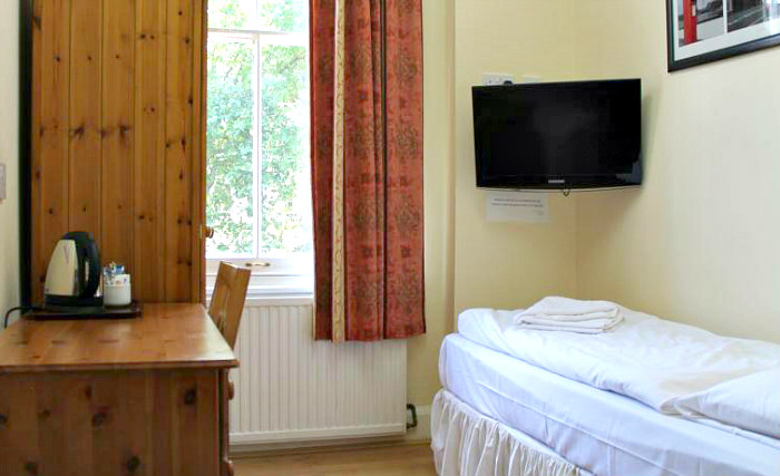 Put your feet up in front of the TV in your room