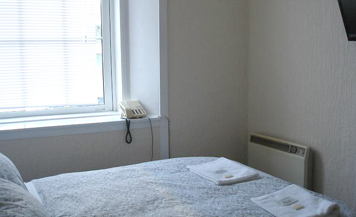 Put your feet up in front of the TV in your room