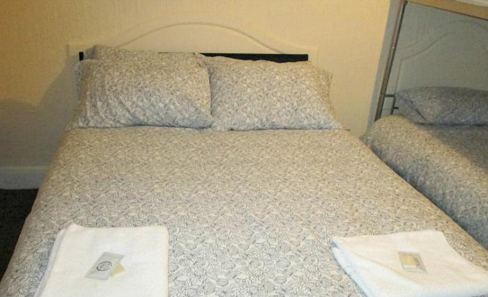 Rest easy in a comfortable bed in your room