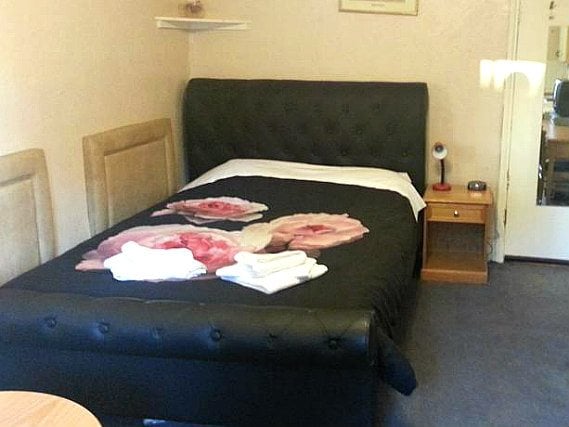 Get a good night's sleep in your comfortable room at Notting Hill Guest House