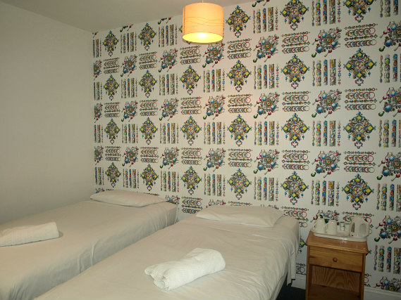 A twin room at Chelsea House Hotel is perfect for two guests