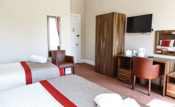 Put your feet up in front of the TV in your room