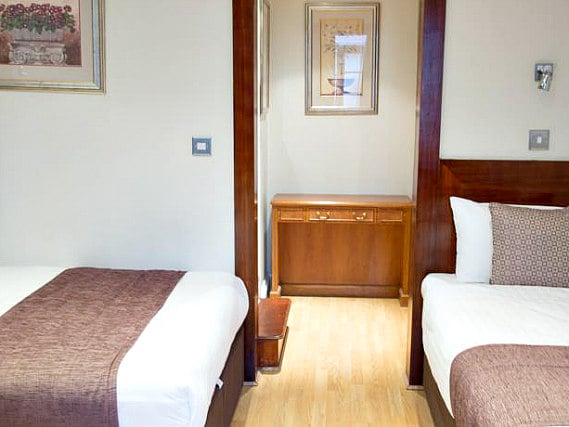 A twin room at Garden View Hotel is perfect for two guests