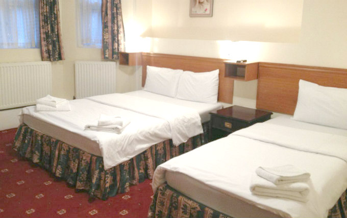 A triple room at Stonebridge Park Hotel