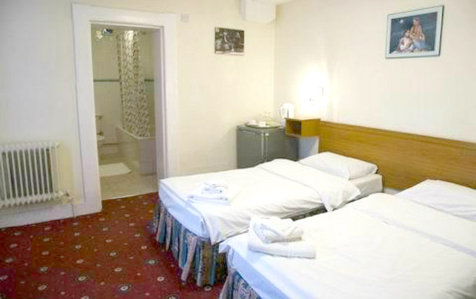 A twin room at Stonebridge Park Hotel
