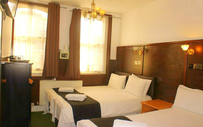 A typical quad room at Plaza London Hotel