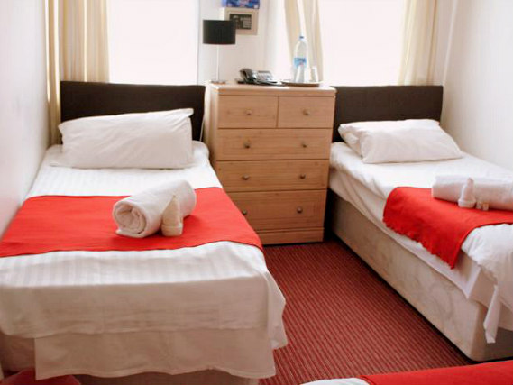 A twin room at Plaza London Hotel is perfect for two guests
