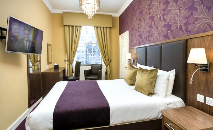 Put your feet up in front of the TV in your room