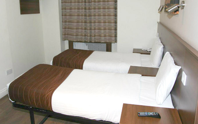 A twin room at Ascot Hotel London