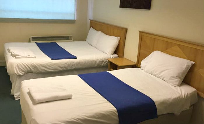 A comfortable twin room at Coronation House