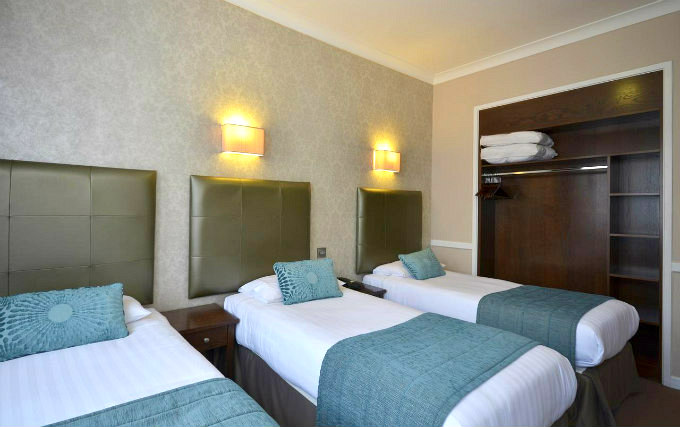 A triple room at Kyriad Hotel London